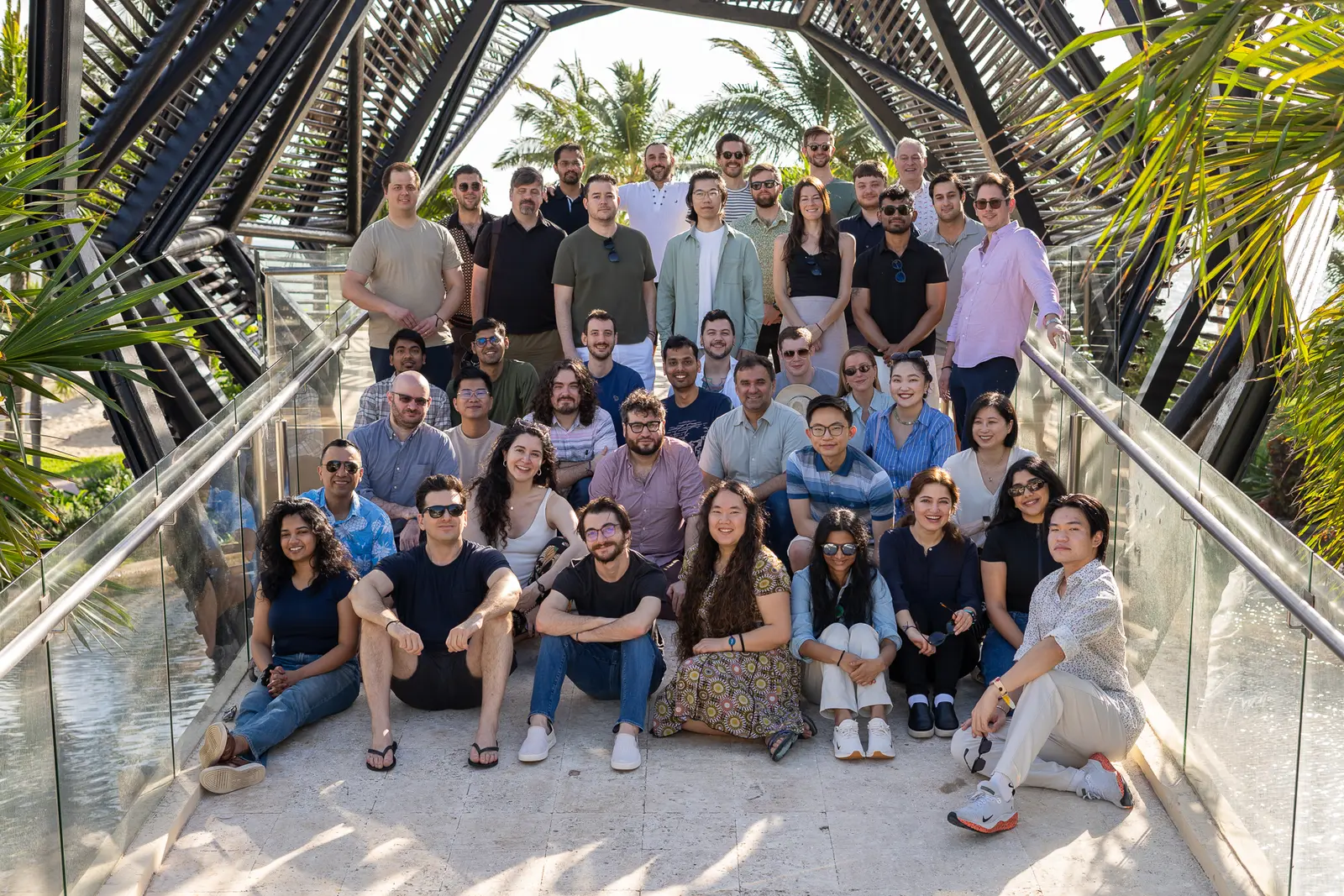 Reality Defender team photographed together on a glass bridge